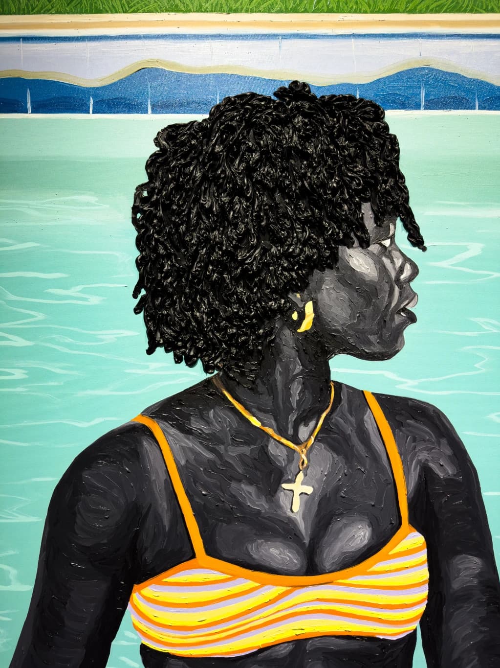 Portrait mural of a woman beside turquoise water
