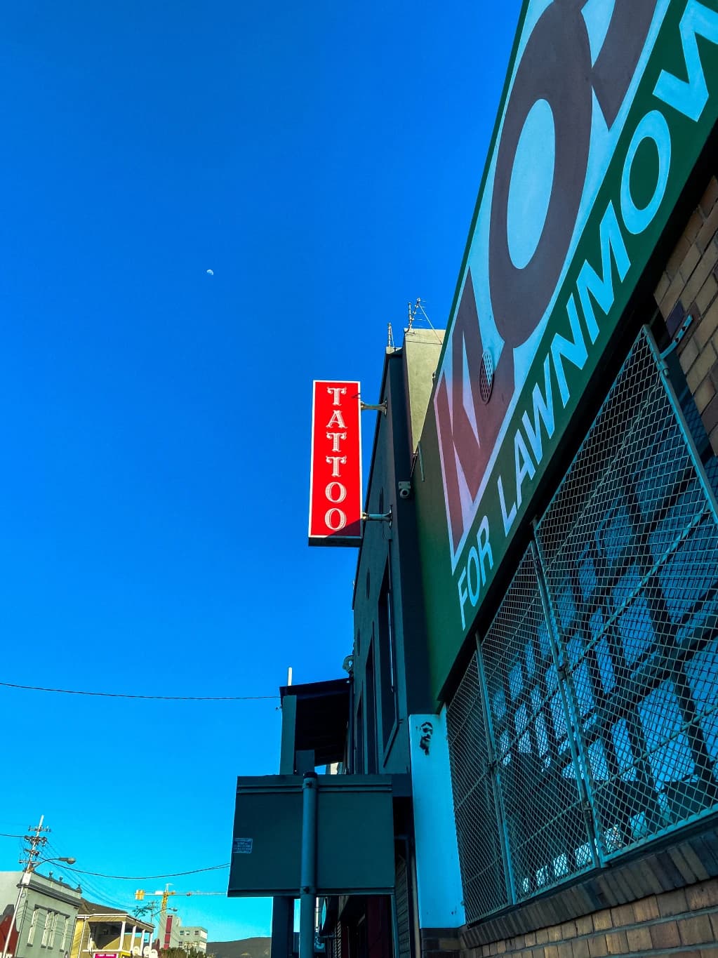 A colorful building beneath a vivid blue sky